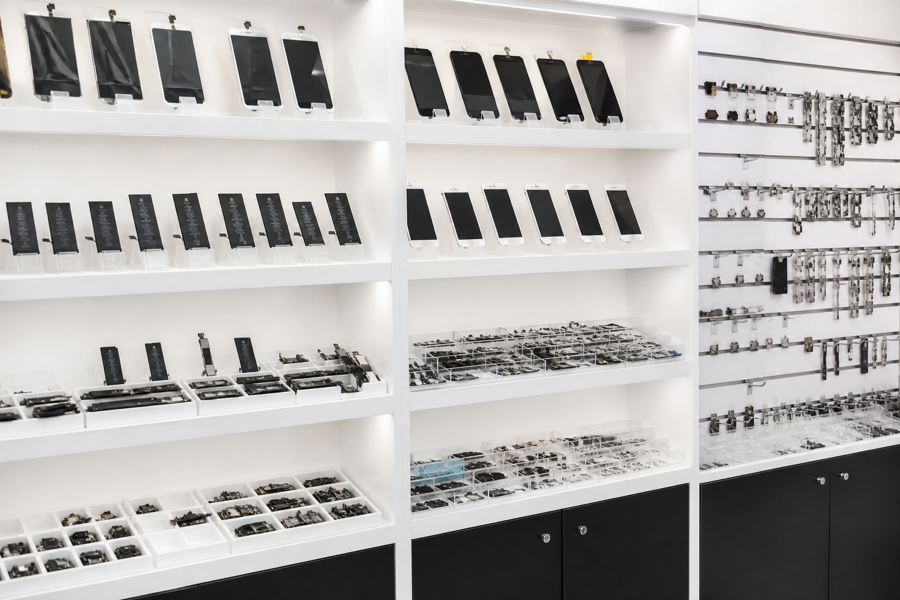 Phone spare parts laid out for matching to a model